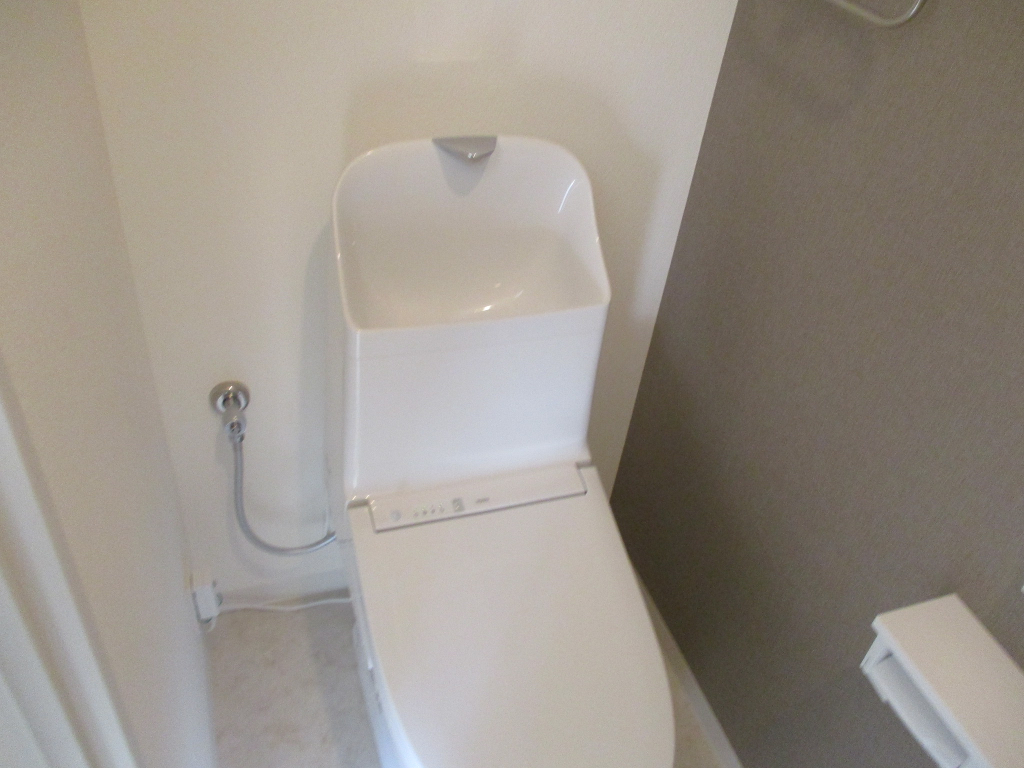 トイレ アクセントクロス 施工後 2