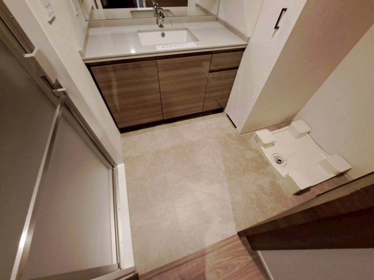 町田市洗面室床リフォーム施工前 マットな石目調フロアタイル